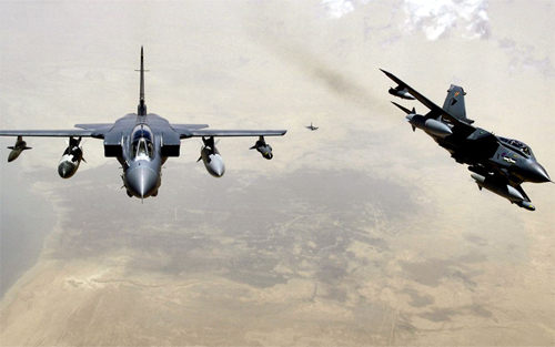 Two RAF Tornado GR-4s pull away from a KC-135 Stratotanker after refueling